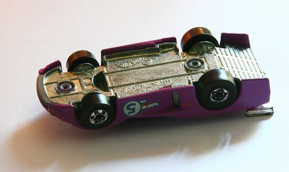 Real Hot Wheels car turned over to show the cast base lettering