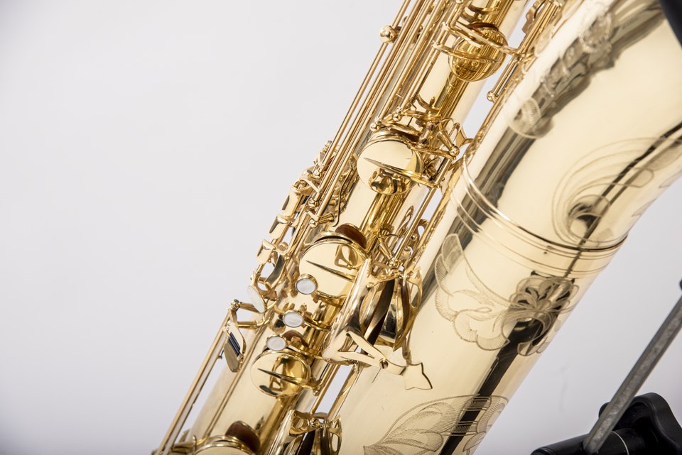 Close real photograph of Selmer engraving on a bass saxophone bell