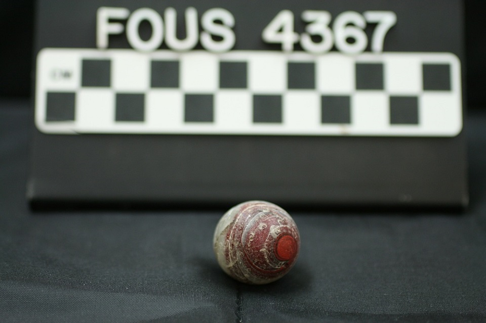 Real 1920s machine-made swirl marble from a National Park Service collection