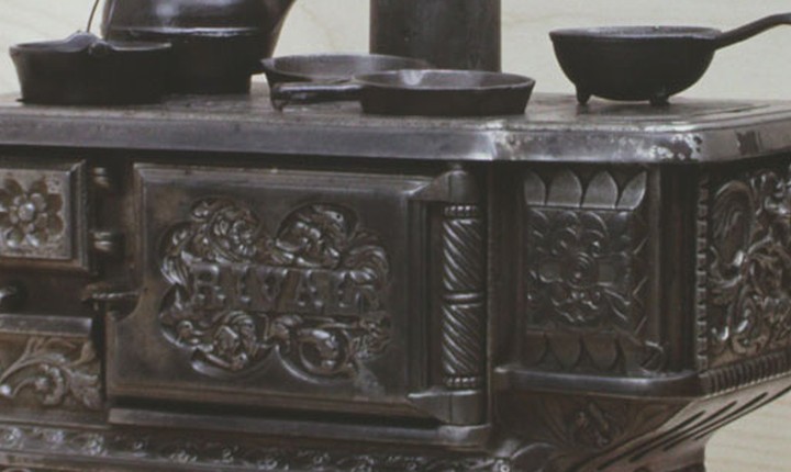 Cropped real Rival toy stove showing the model name on the front door