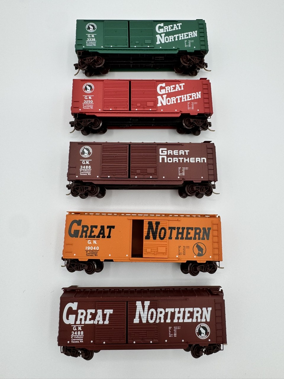 Five real Micro-Trains Great Northern convention cars with distinct road numbers arranged together