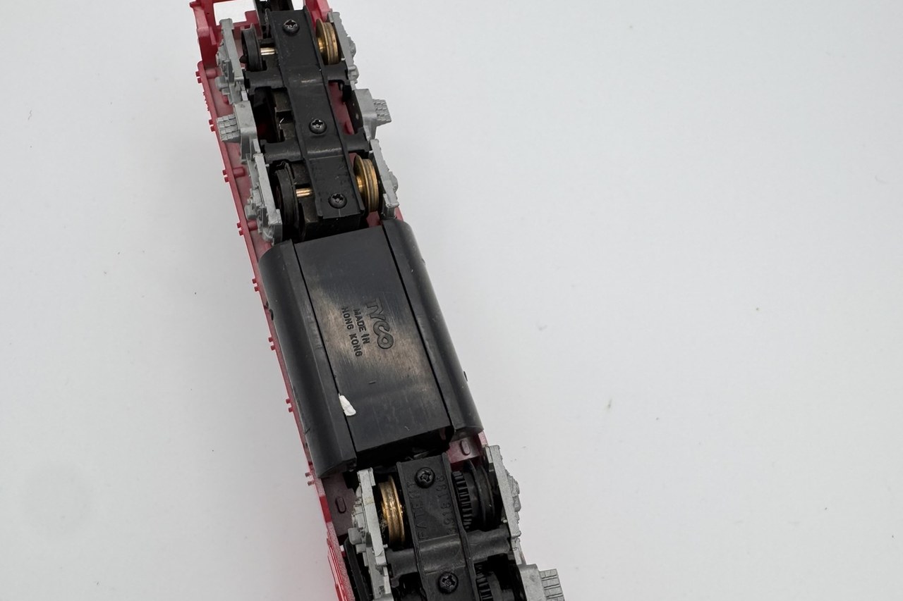 Real TYCO locomotive underside showing the TYCO Made in Hong Kong mark and drive components