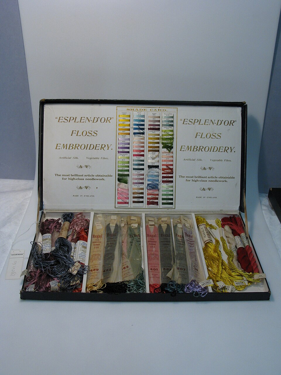 Open embroidery-silk box with numbered skeins and shade card