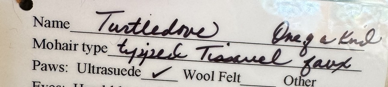 Handwritten line on an artist bear card reading Mohair type, filled in as tipped Tissavel faux